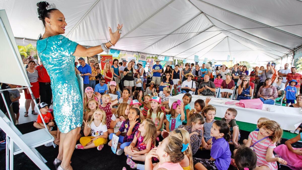 Fancy Nancy book illustrator Robin Preiss Glasser entertains a crowd at the Children's Pavilion on Saturday during the San Diego Festival of Books at Liberty Station