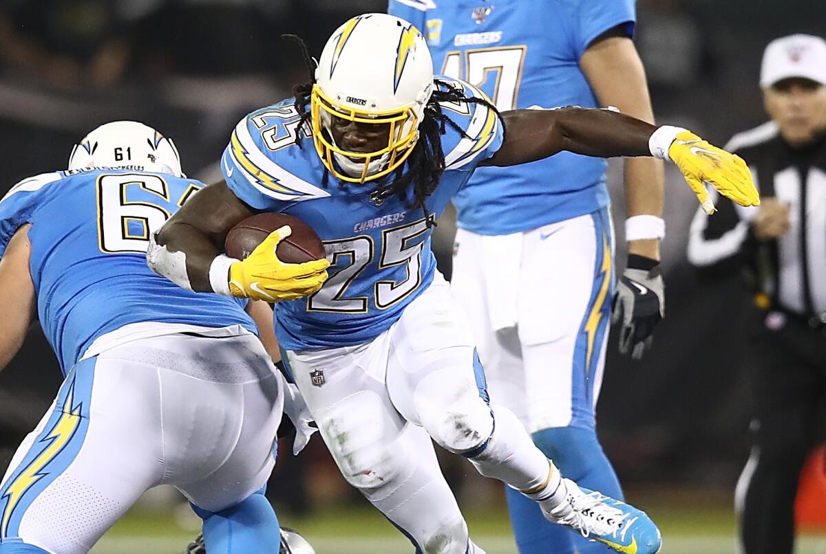 Chargers running back Melvin Gordon carries the ball against the Raiders.