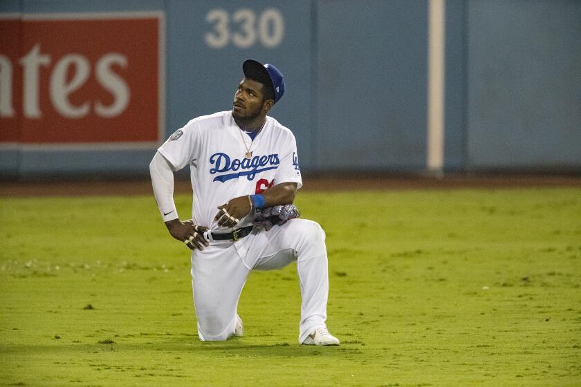 LOS ANGELES, CA - OCTOBER 26, 2018:Los Angeles Dodgers right fielder Yasiel Puig (66) watches the video screen during a play review in Game 3 of the World Series at Dodger Stadium on October 26, 2018 in Los Angeles, California.(Gina Ferazzi/Los AngelesTimes)