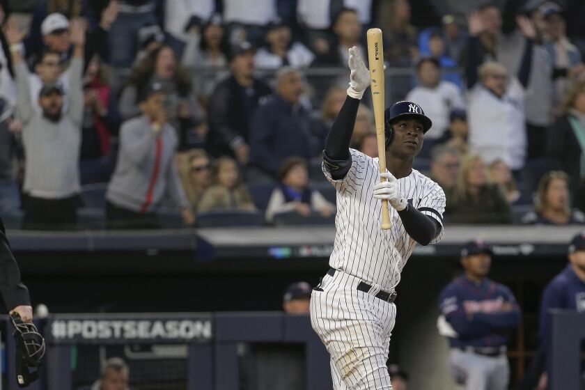 New York Yankees' Didi Gregorius reacts after hitting a grand slam home run against the Minnesota Twins during the third inning of Game 2 of an American League Division Series baseball game, Saturday, Oct. 5, 2019, in New York. (AP Photo/Seth Wenig)