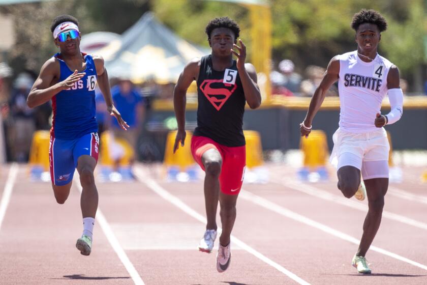Moorpark, CA - May 21: Rodrick Pleasant of Gardena Serra High, center, is out in front.