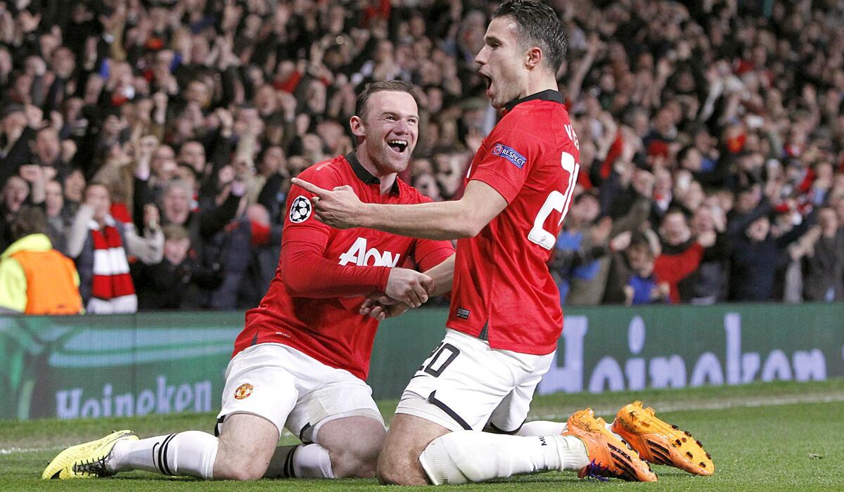 Strikers Wayne Rooney, left, and Robin van Persie will soon be sporting a new look with their Manchester United uniforms.