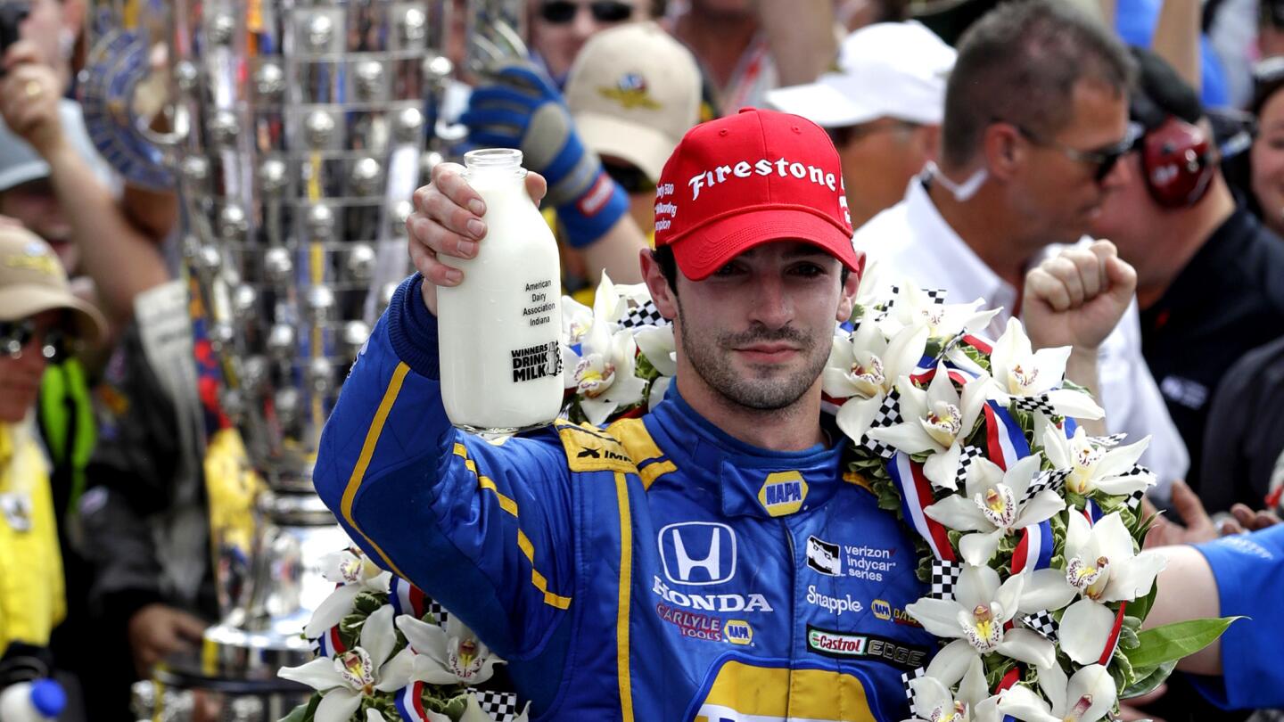 Alexander Rossi celebrates with the traditional bottle of milk after winning the 100th running of the Indianapolis 500 on Sunday.
