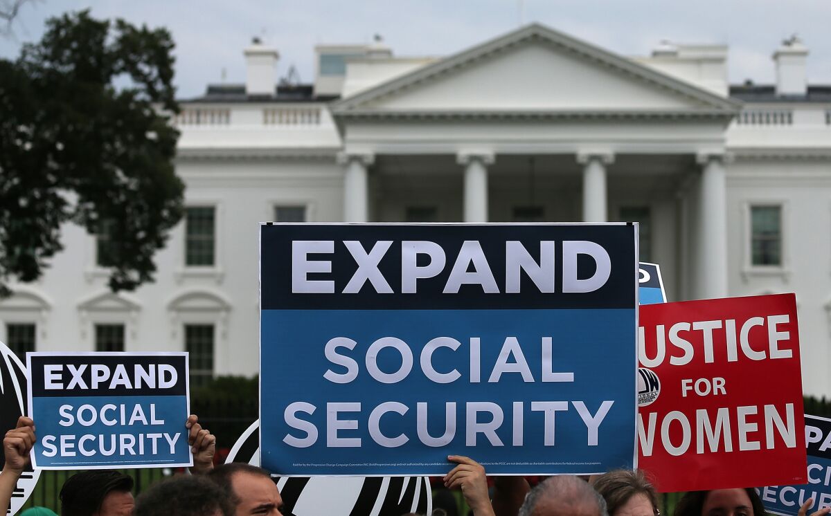Activists participate in a rally in front of the White House last week, urging the expansion of Social Security benefits.