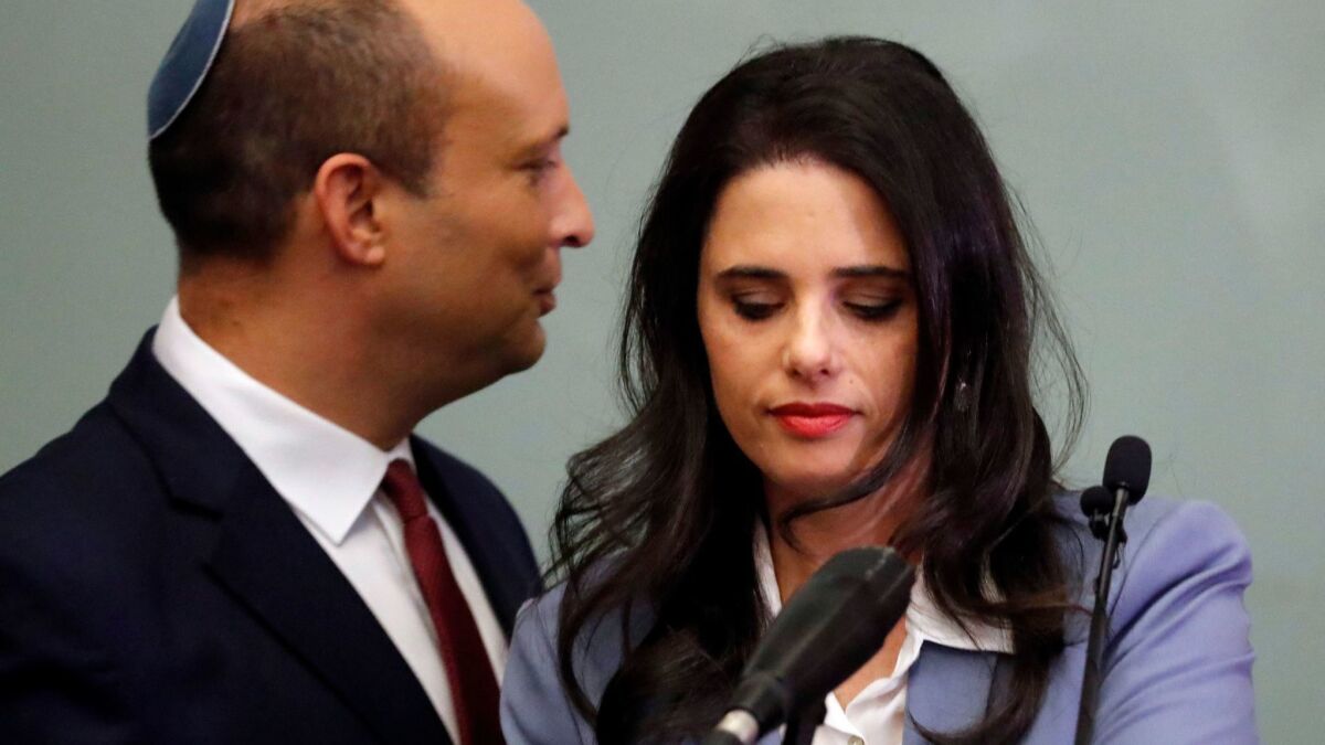 Israeli Education Minister Naftali Bennett, left, and Justice Minister Ayelet Shaked give statements at the Knesset in Jerusalem on Monday.