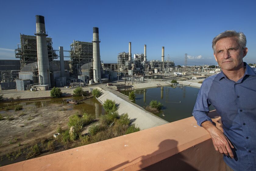 REDONDO BEACH, CA-NOVEMBER 22, 2019: Redondo Beach Mayor Bill Brand is photographed next to the AES Power Plant in Redondo Beach that is currently supposed to close in 2020 due to environmental regulations. California’s State Water Resources Control Board is considering a request from the Public Utilities Commission to allow this power plant to stay open longer. Brand is opposed to the extension. (Mel Melcon/Los Angeles Times)