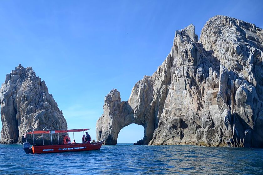BAJA CALIFORNIA SUR, MEXICO - Water taxi approaches El Arco, Cabo San Lucas, 2015. (Christopher Reynolds/Los Angeles Times)