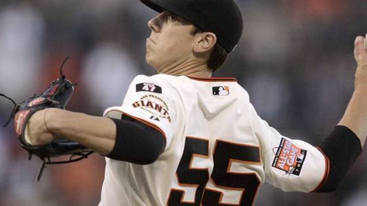 Tim Lincecum with long hair and a smile