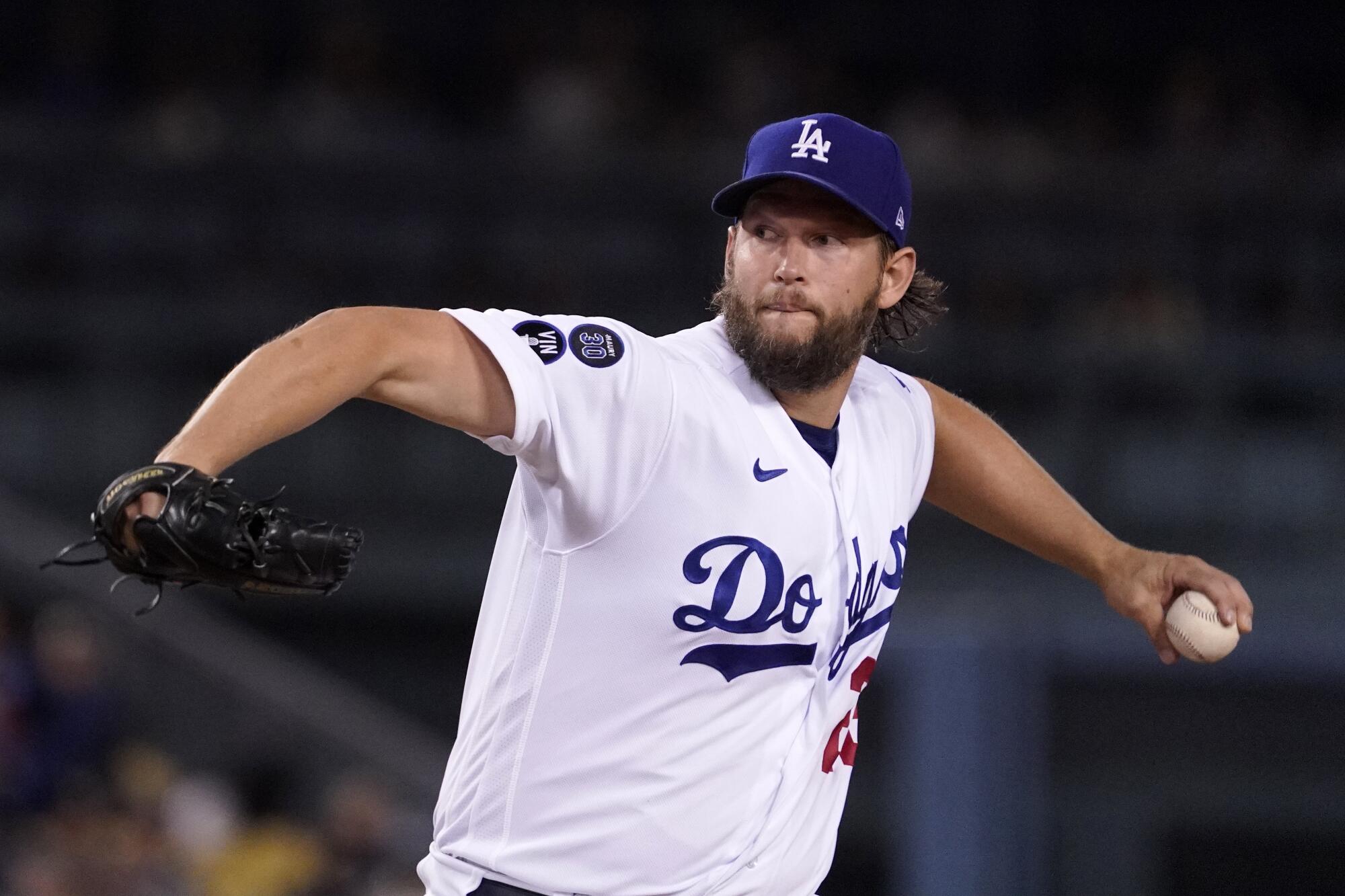 Dodgers starting pitcher Clayton Kershaw delivers a pitch.