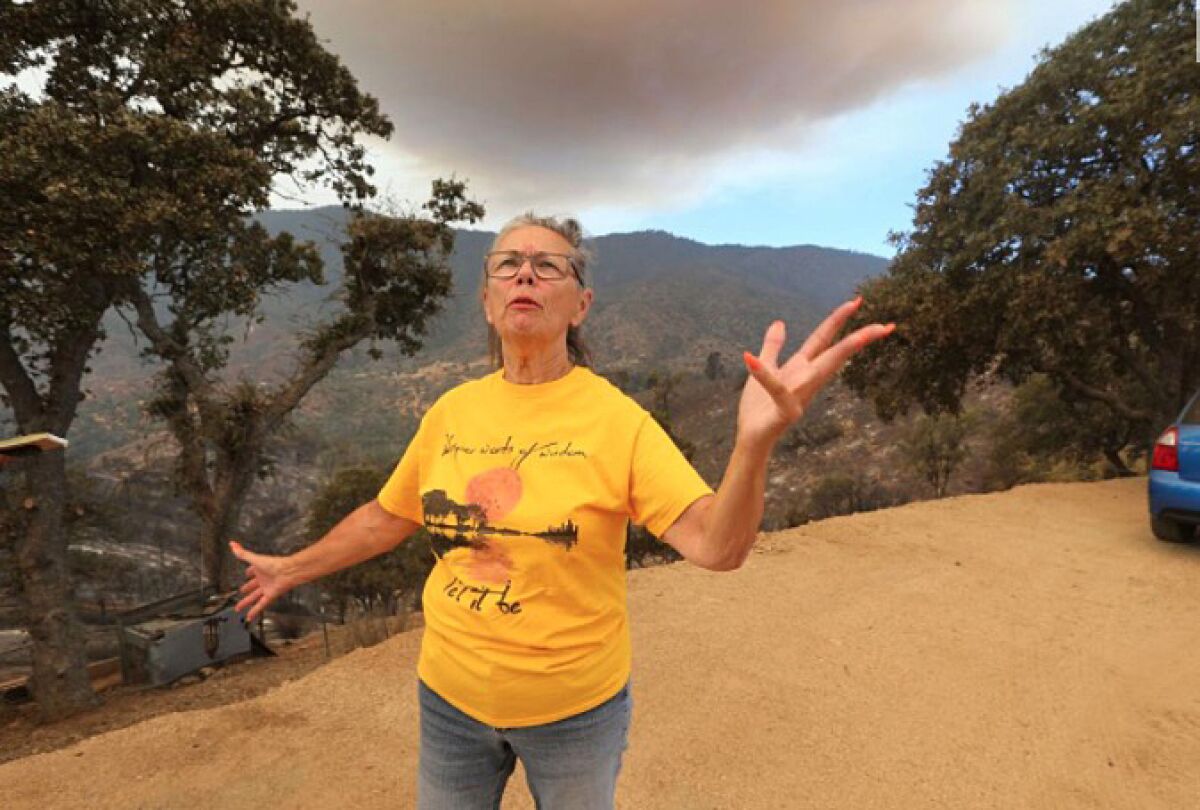 Patricia Paine said her son cleared away brush and saved her home from the Stagecoach fire in Plute Meadows. 