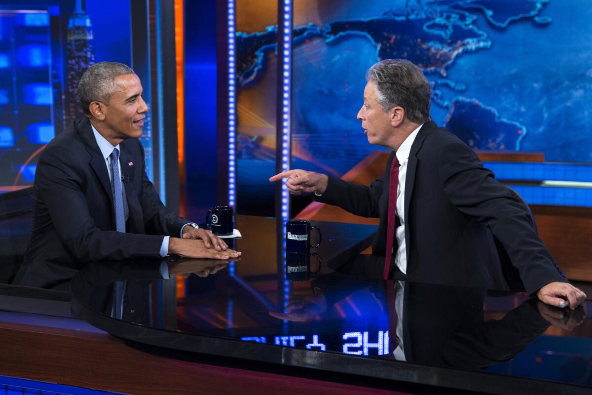 President Obama talks with Jon Stewart, host of "The Daily Show," during a taping on July 21 in New York.