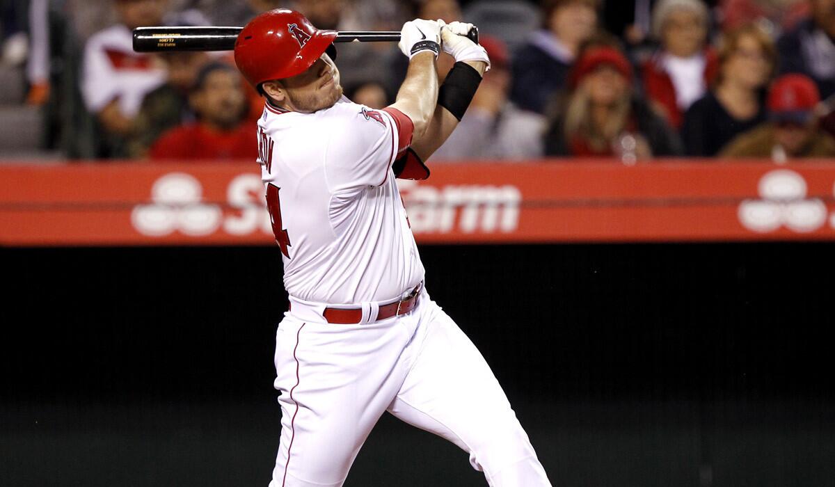 Los Angeles Angels’ C.J. Cron hits a sacrifice fly to score David Freese during the fifth inning against the Houston Astros on May 8.