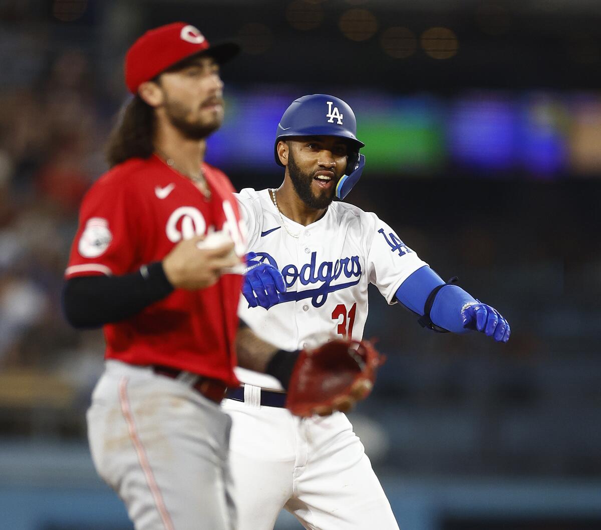 Amed Rosario smiles after hitting a double during the fourth inning of his Dodgers debut Friday.