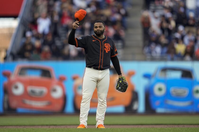 San Francisco Giants third baseman Pablo Sandoval gestures to fans after taking the field during the sixth inning of a spring training baseball game against the Oakland Athletics, Tuesday, March 26, 2024, in San Francisco. (AP Photo/Godofredo A. Vásquez)