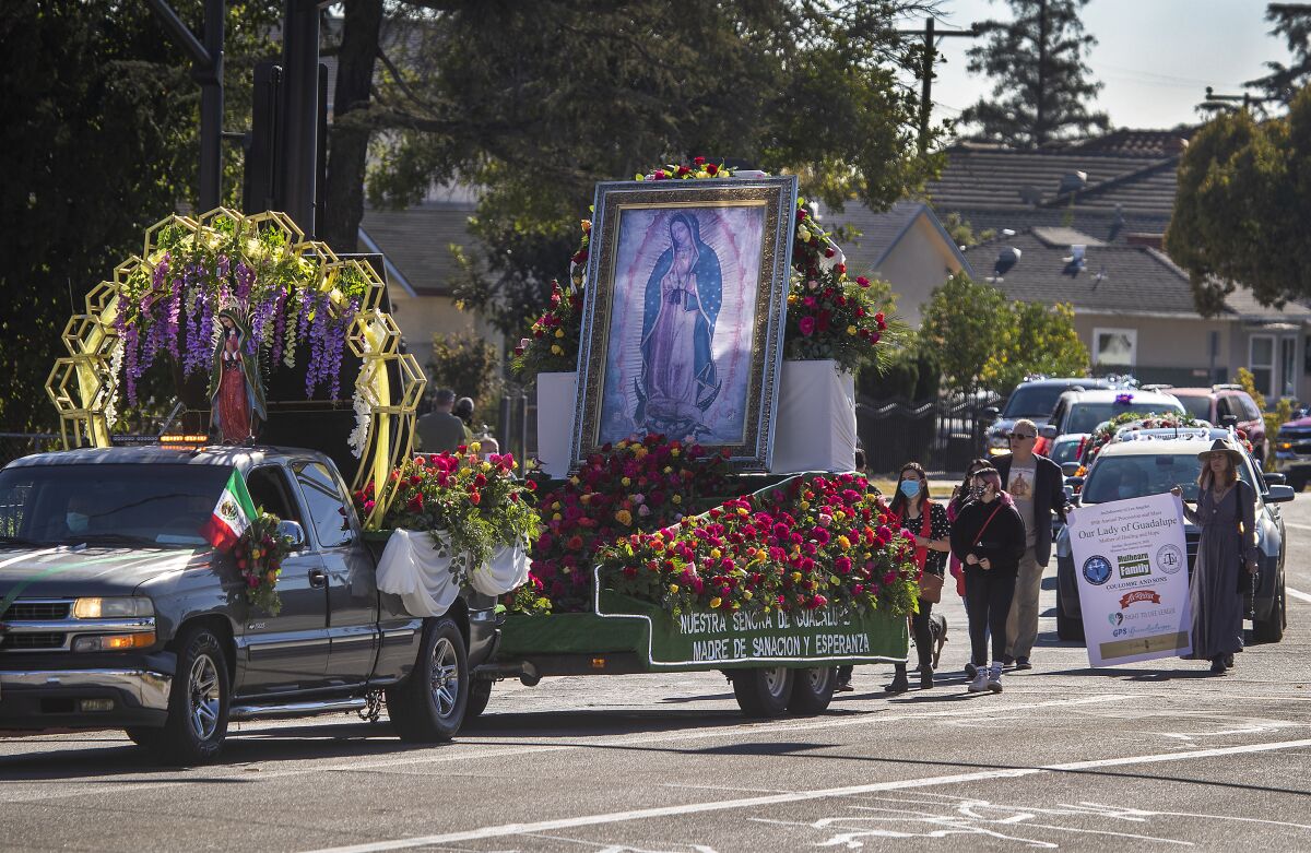 Parishioners celebrate Virgen de Guadalupe during a procession Sunday in San Gabriel.