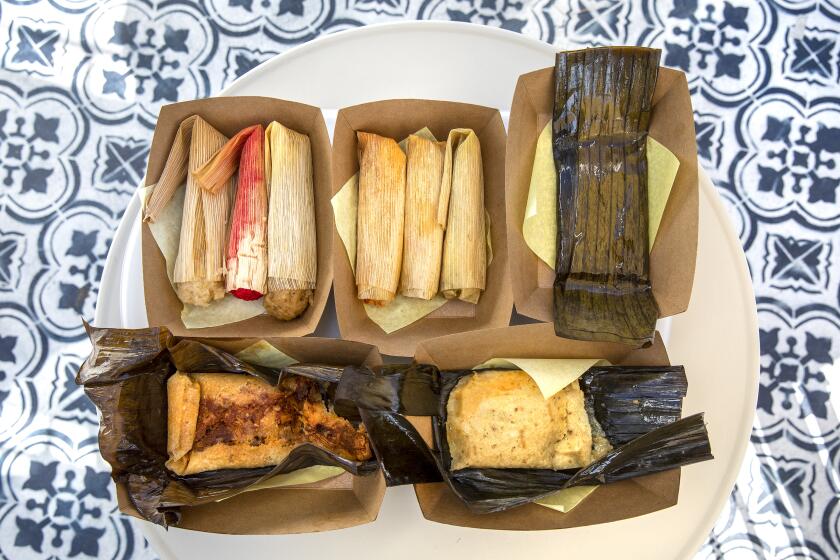 BELL GARDENS, CA -OCTOBER 01, 2020: Tamales wrapped in corn husks and banana leafs are on the menu at Tamales Elena Y Antojitos, an Afro-Mexican restaurant in Bell Gardens. (Mel Melcon / Los Angeles Times)