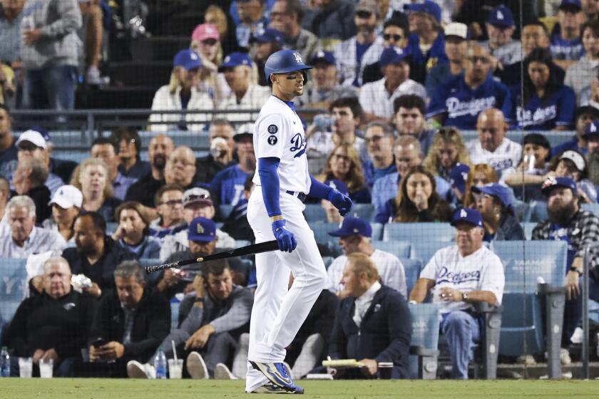 Los Angeles, CA - October 12: Los Angeles Dodgers' Trayce Thompson walks back to the dugout after striking out during the fourth inning in game two of the NLDS against the San Diego Padres at Dodger Stadium on Wednesday, Oct. 12, 2022 in Los Angeles, CA.(Gina Ferazzi / Los Angeles Times)