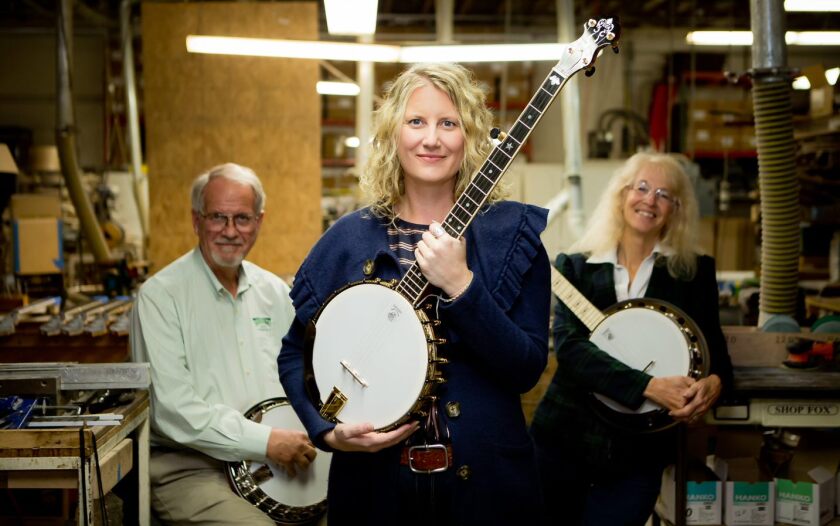 Jamie Deering (center), the new CEO of Deering Banjos, is shown with her parents, Greg and Janet