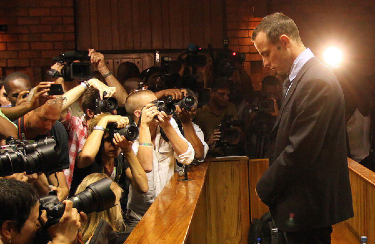 South African Olympic sprinter Oscar Pistorius stands in the dock during a bail hearing at the Pretoria Magistrate's Court in February.