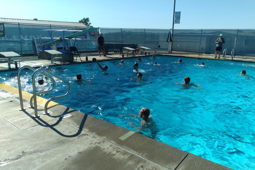 Ramona High School boys water polo team practicing.