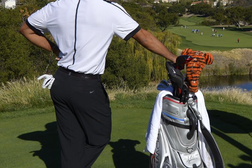 Tiger Woods waits to hit on the 13th hole during the pro-am portion of the Northwestern Mutual World Challenge at Sherwood Country Club in Thousand Oaks on Wednesday.