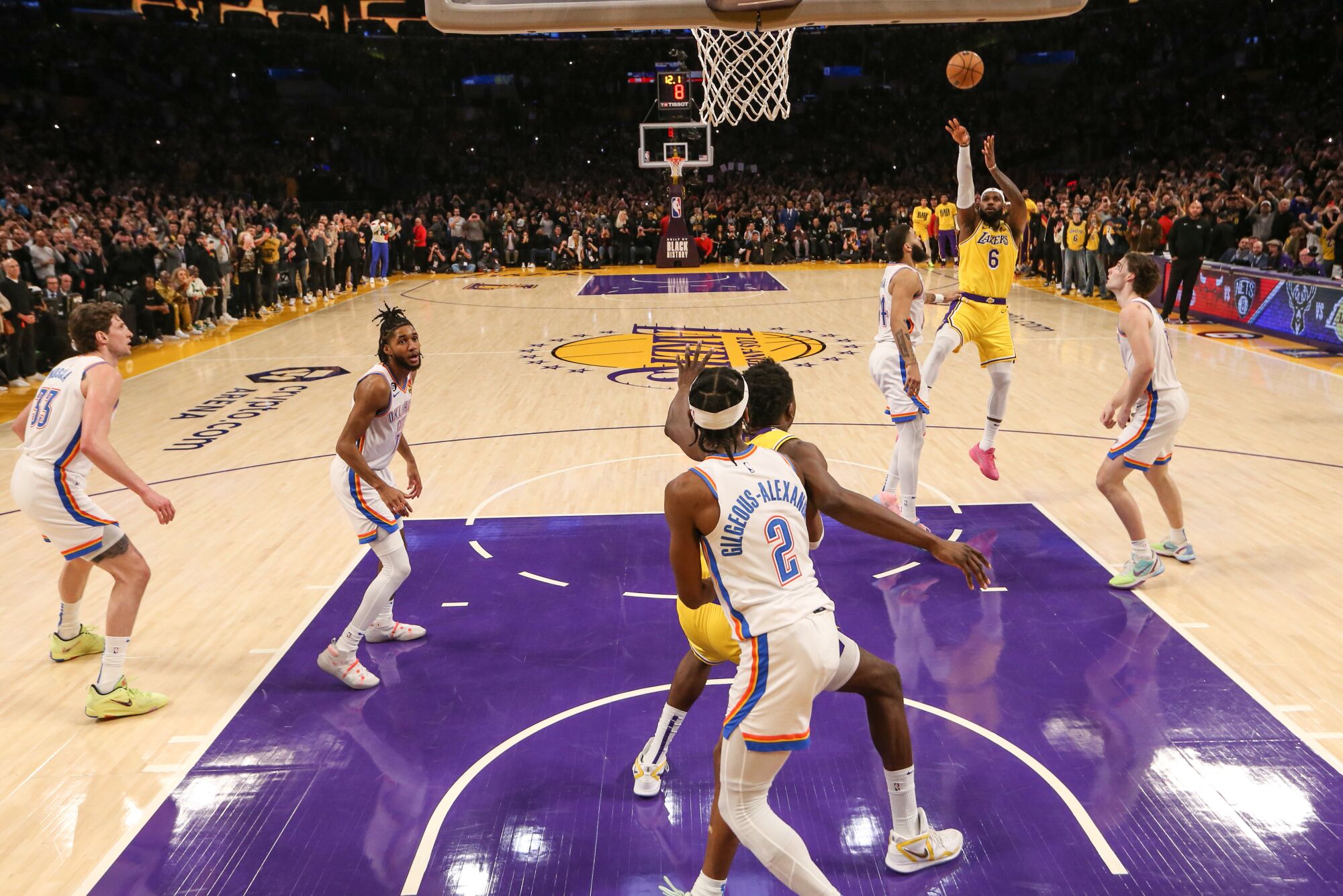 LeBron James launches a fade-away jumper to score his 38,388th career point to attain the NBA scoring title.