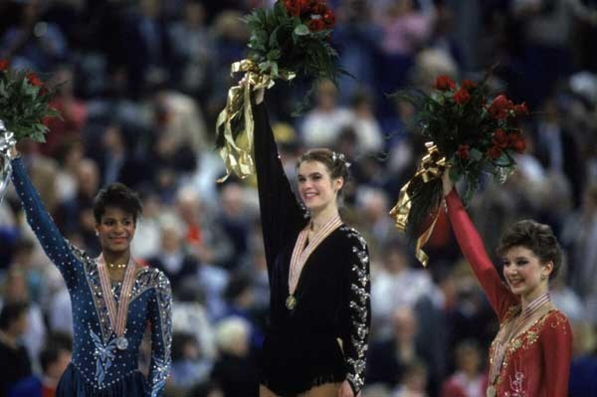 Figure skater Katrina Witt, center, is profiled in a new episode of "Nine for IX" on ESPN and ESPN2. With Debra Thomas, left and Caryn Kadavy.