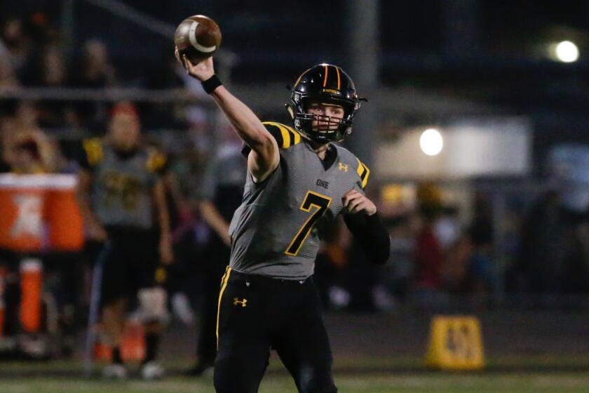 THOUSAND OAKS, CA - SEPTEMBER 16: Newbury Park quarterback Brady Smigiel (7) passes against Royal.