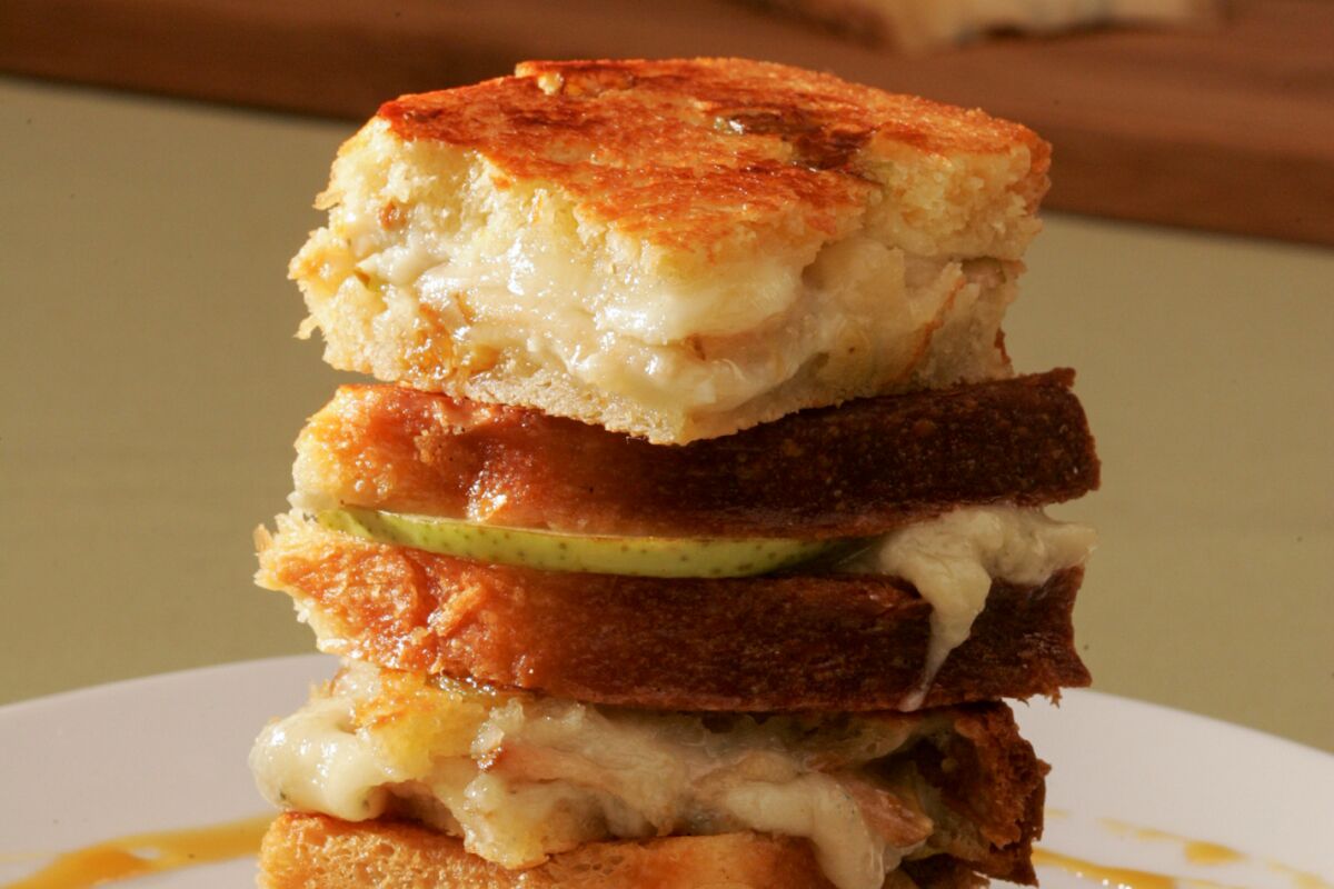 A stacked grilled blue cheese with a pear sandwich