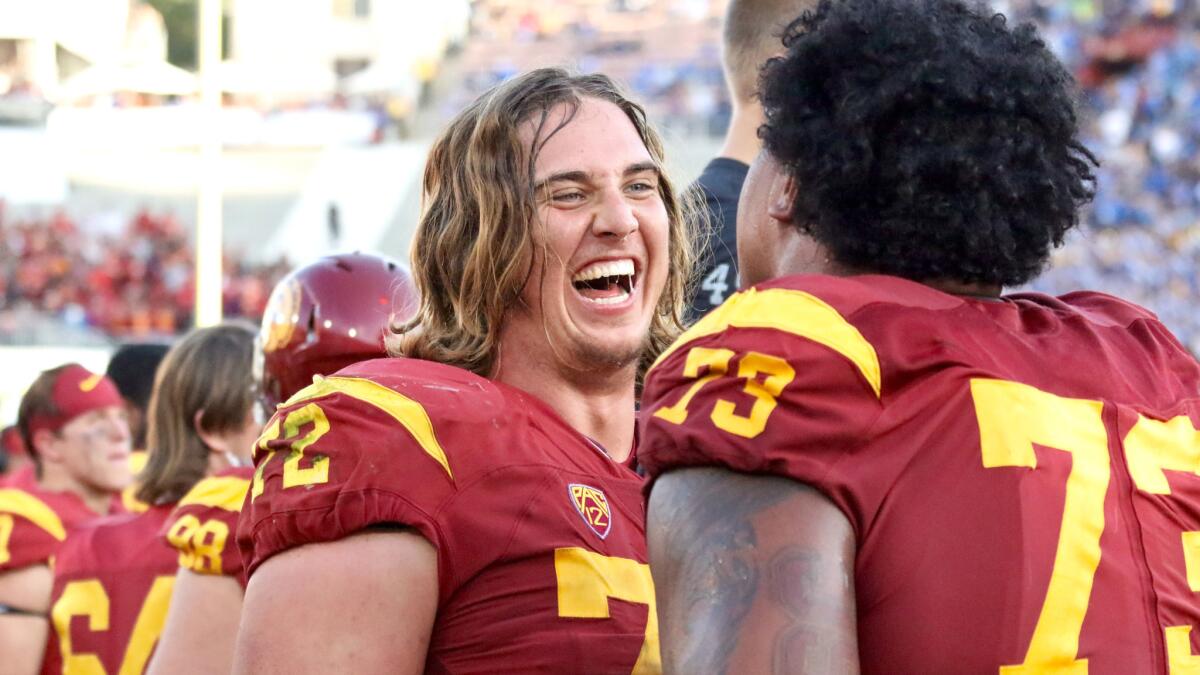 Chad Wheeler (72) shares a laugh with fellow USC offensive lineman Zach Banner (73) during the fourth quarter of a game against UCLA.