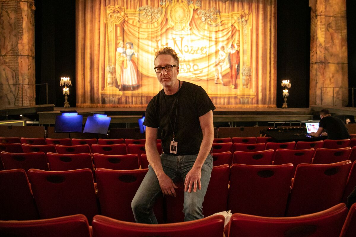 A man in an auditorium.