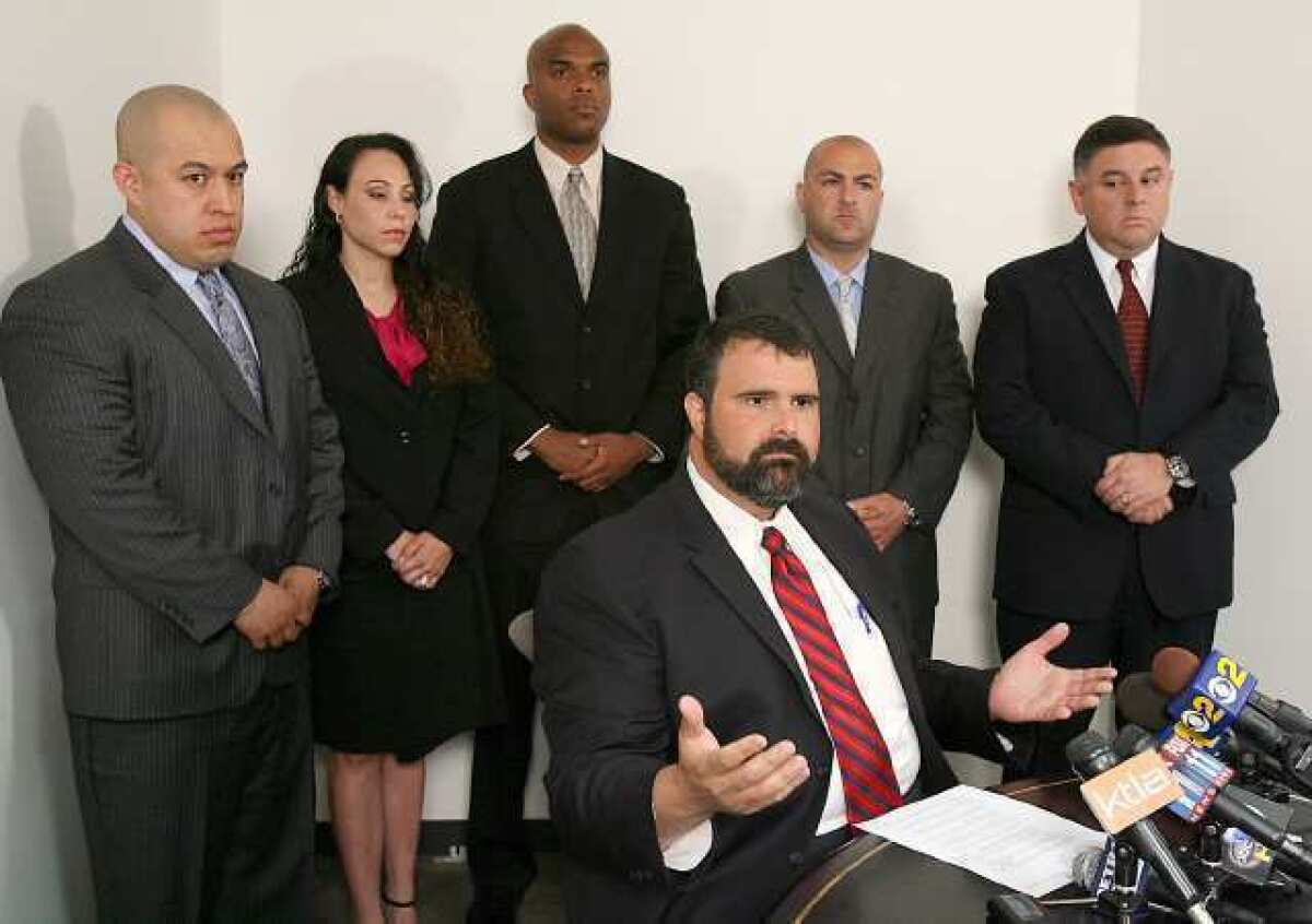 ARCHIVE PHOTO: Solomon E. Gresen, Esq. addresses news media regarding the law suit filed by these five police officers against the Burbank Police Department in Brentwood Monday June 1, 2009. The officers, seen behind, are (L-R) Elfego Rodriquez, Cindy Guillen-Gomez, Jamal Childs, Det. Steve Karagiosian, and Lt. Omar Rodriguez.