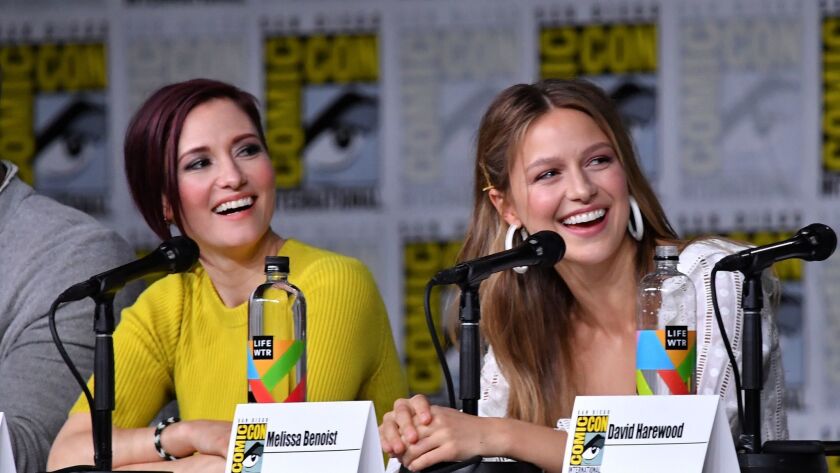 Chyler Leigh and Melissa Benoist speak onstage at the "Supergirl" panel during Comic-Con International 2018 at San Diego Convention Center.