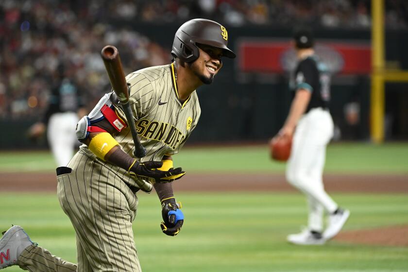 PHOENIX, ARIZONA - MAY 04: Luis Arraez #4 of the San Diego Padres tosses his bat and reacts after hitting an RBI single against the Arizona Diamondbacks during the fourth inning at Chase Field on May 04, 2024 in Phoenix, Arizona. (Photo by Norm Hall/Getty Images)