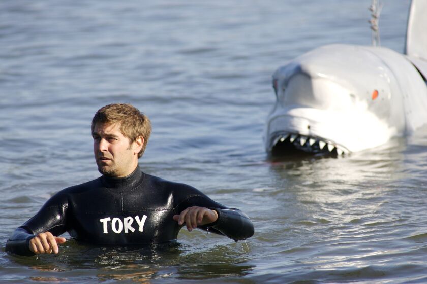 Tory Belleci demonstrates the power of a shark's bite for an episode of "Mythbusters" in 2008.