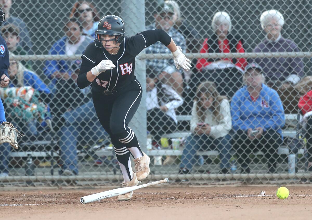 Huntington Beach's Saige Anderson (47) sprints for first base after laying down a bunt against Los Alamitos on Tuesday.