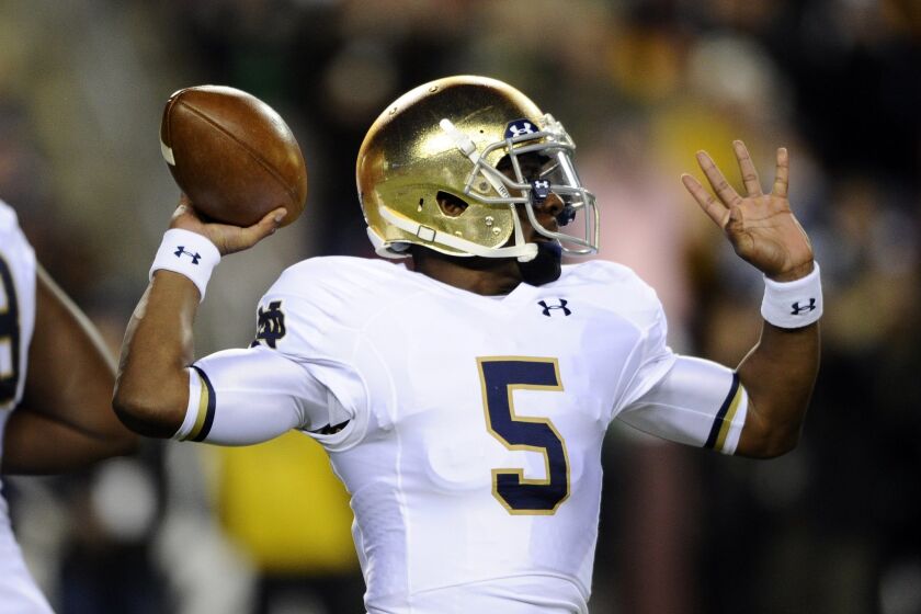 Notre Dame quarterback Everett Golson looks to pass during the first half an NCAA college football game against Navy, Saturday, Nov. 1, 2014, in Landover, Md. (AP Photo/Nick Wass)
