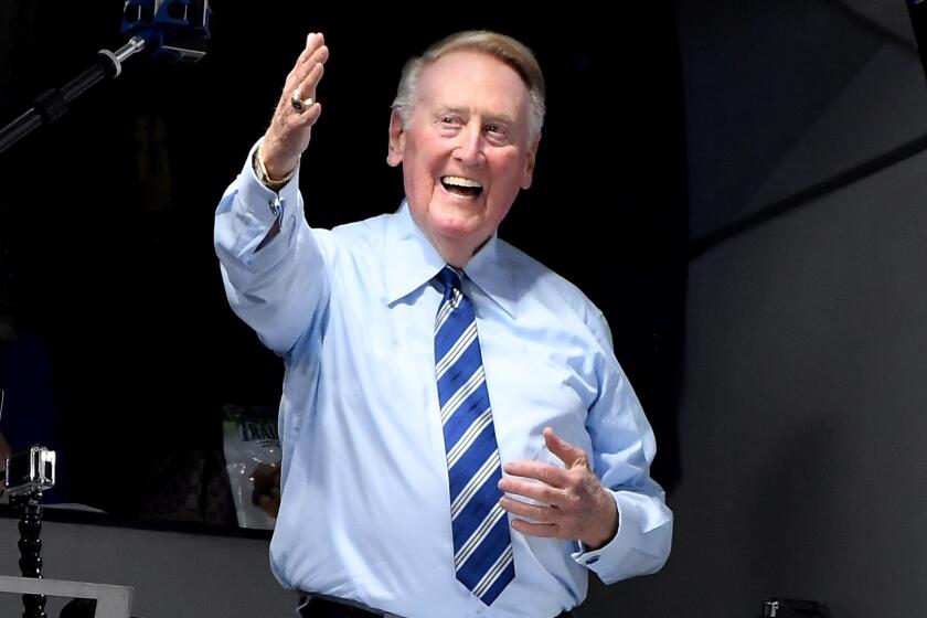 LOS ANGELES, CALIFORNIA SEPTEMBER 20, 2016-Dodgers announcer Vin Scully greets the crowd.