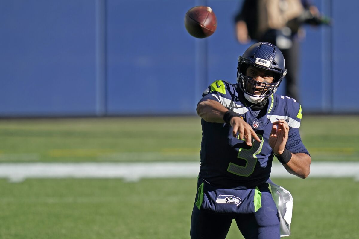 Seattle Seahawks quarterback Russell Wilson passes against the San Francisco 49ers on Sunday.