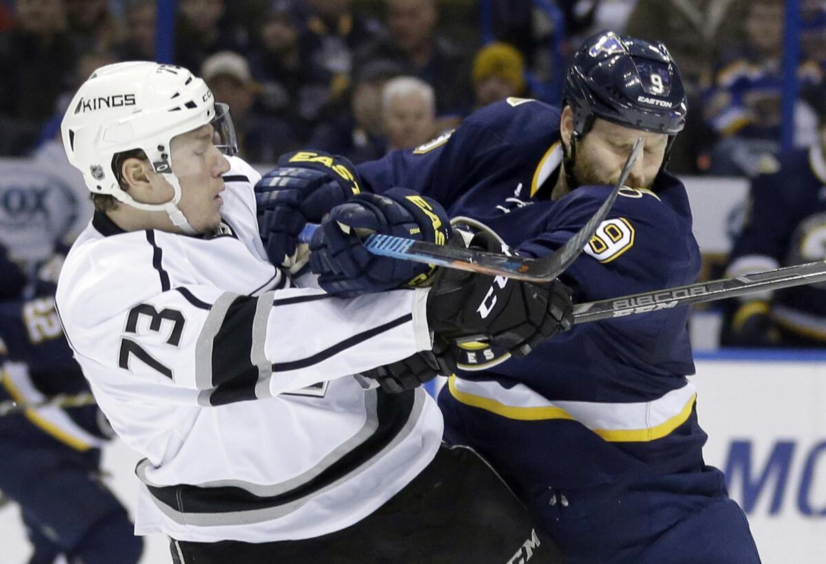 Tyler Toffoli is checked by St. Louis forward Steve Ott during the second period of the Kings' 5-2 loss Tuesday to the Blues.