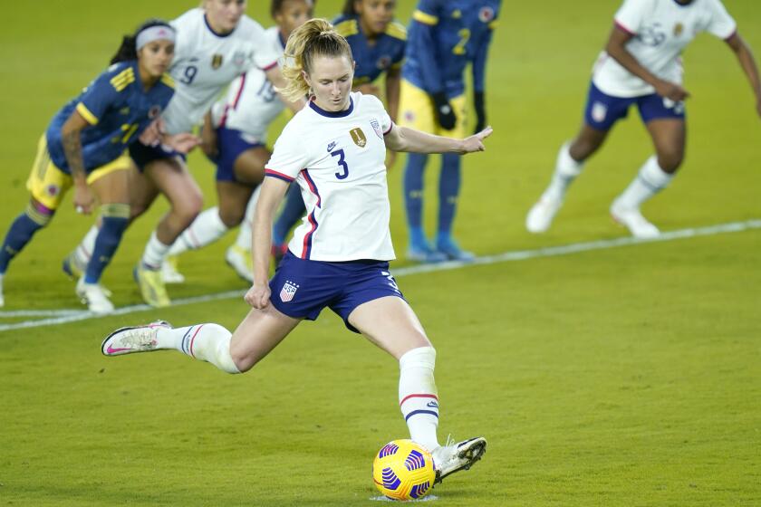 United States midfielder Samantha Mewis (3) scores a goal on a penalty kick.