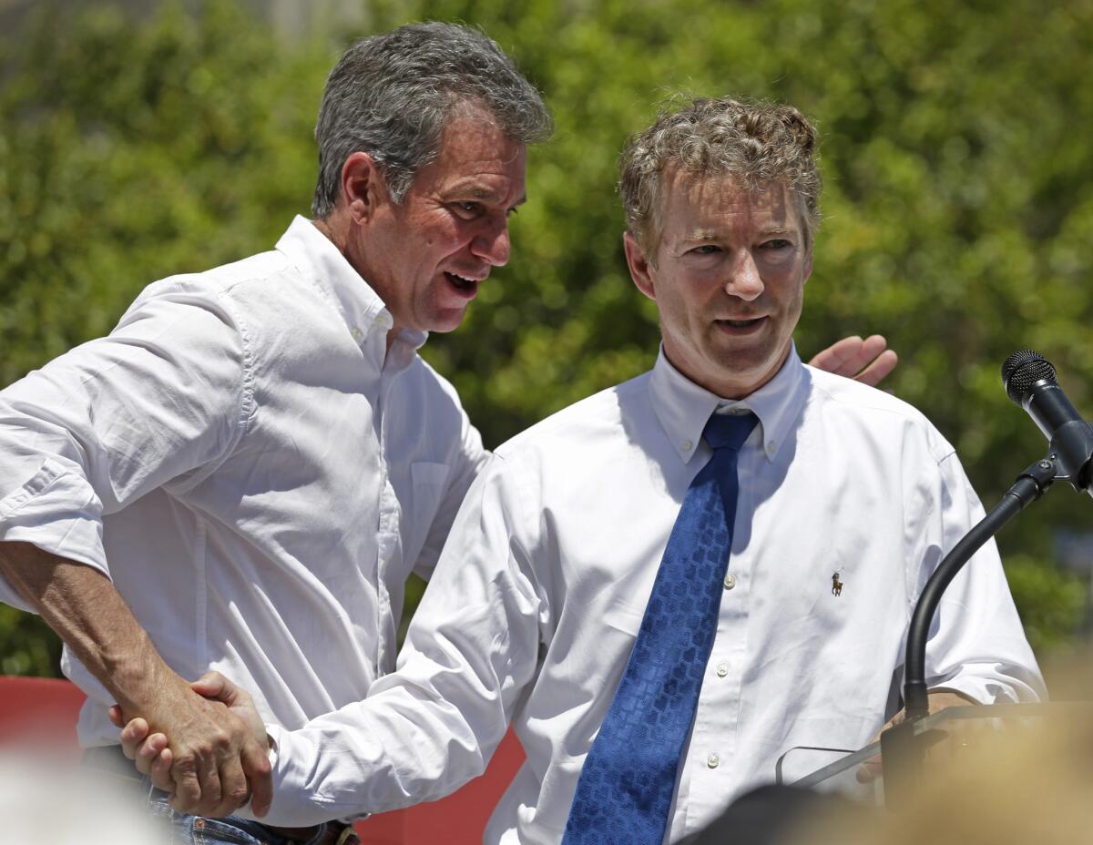 Republican Senate hopeful Greg Brannon, left, of North Carolina is introduced by Sen. Rand Paul (R-Ky.) during a campaign event in Charlotte.