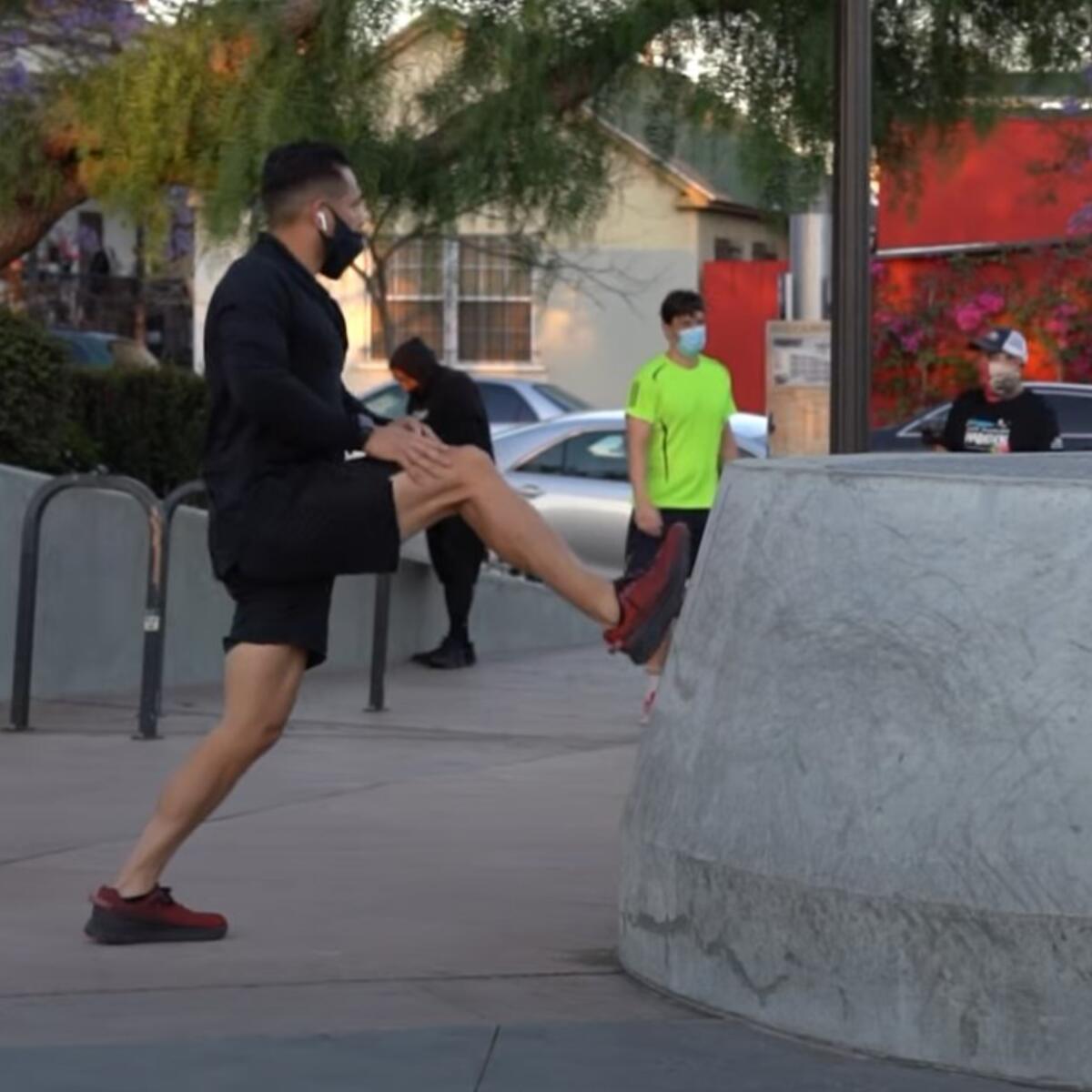 A man stretches in preparation for a run.