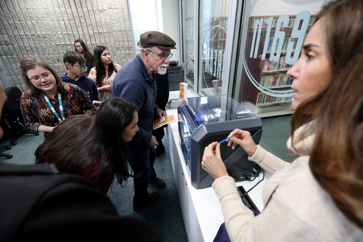 Local residents get a first look at the new Spark! Digital Media Lab in the Burbank Central Library during a ribbon-cutting ceremony on Thursday.