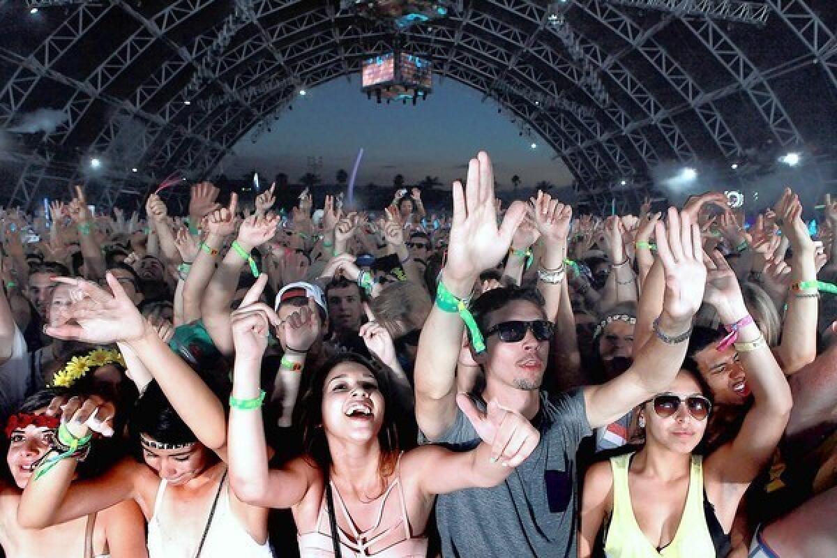 Fans in the Sahara tent dance to Dog Blood.