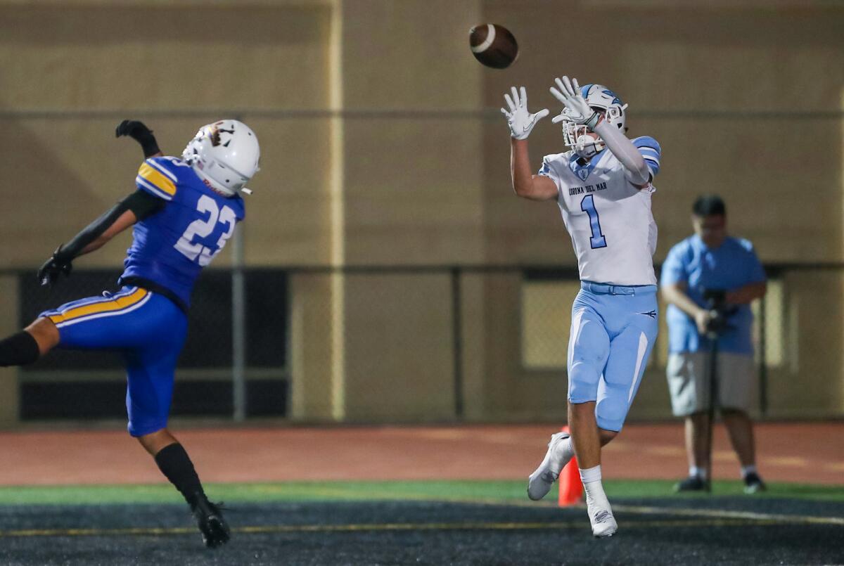 Corona del Mar's Cooper Hoch (1) makes a catch in the end zone in a Sunset League football opener versus Fountain Valley.