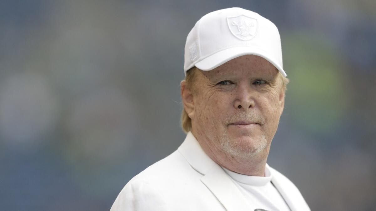 Oakland Raiders owner Mark Davis stands on the field before a preseason game against the Seattle Seahawks on Aug. 30.