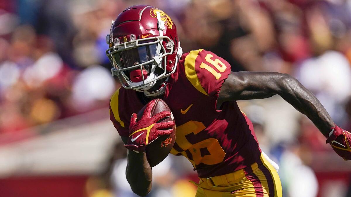 USC wide receiver Tahj Washington runs with the ball against Rice on Sept. 3.
