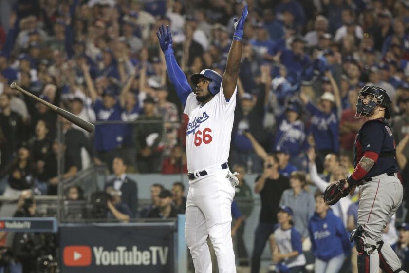 Los Angeles Dodgers' Yasiel Puig celebrates after his three-run home run against the Boston Red Sox during the sixth inning in Game 4 of the World Series baseball game on Saturday, Oct. 27, 2018, in Los Angeles. (AP Photo/Jae C. Hong)