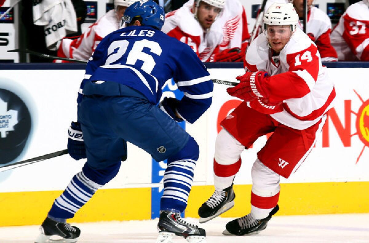 Gustav Nyquist, left, and the Detroit Red Wings head east to play in a new conference agianst the likes of John-Michael Liles and the Toronto Maple Leafs.